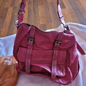 Real leather red purse in good condition. A great bag for the holiday season.